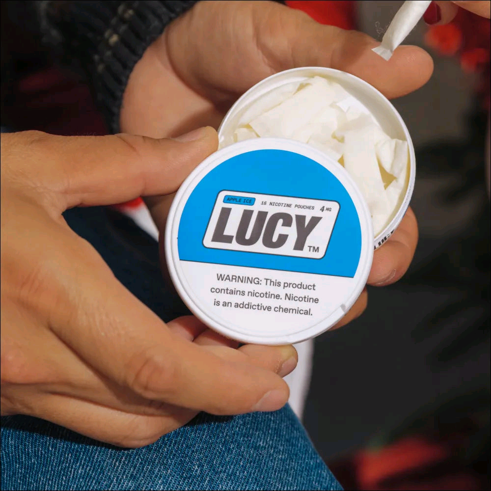 Lucy nicotine pouch, in hand